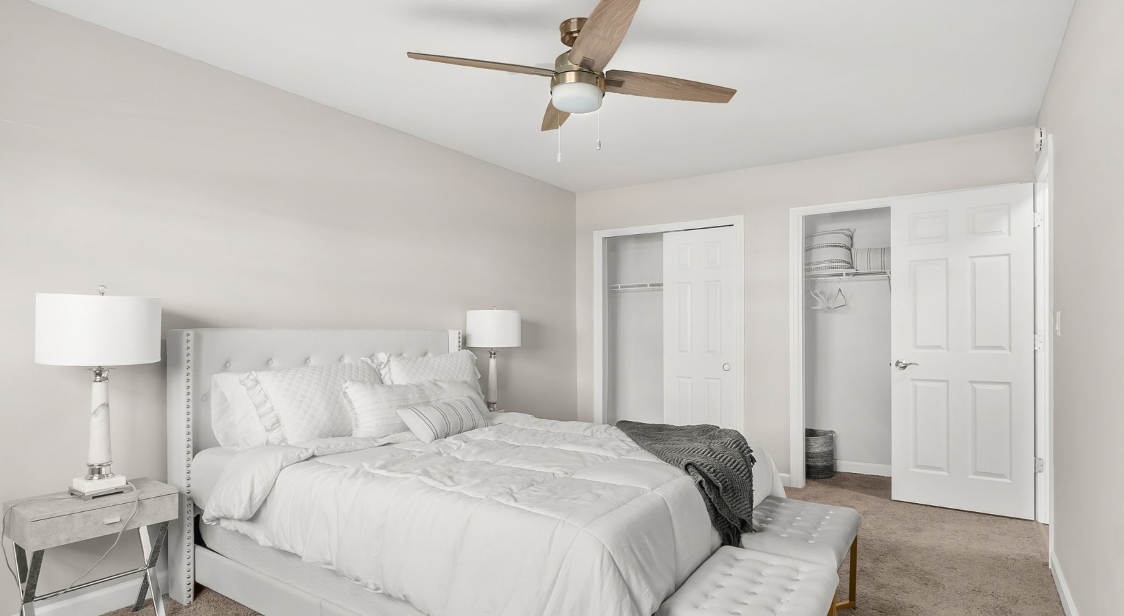 bedroom with bed ceiling fan and lamp