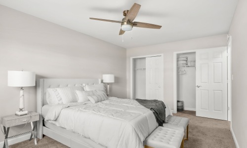 bedroom with bed ceiling fan and lamp